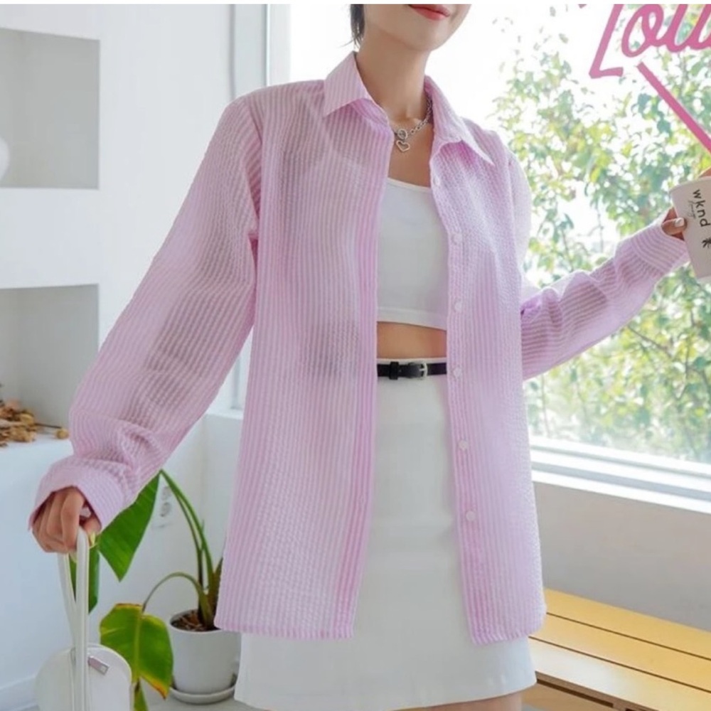 Women’s pink and white striped oversized button down top